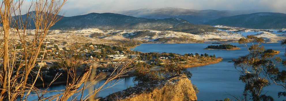 Scenic view of Jindabyne town and Lake Jindabyne, from on top of a mountain